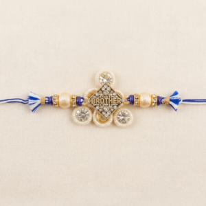 RichMade Premium BROTHER designer rakhi with crystal-studded centerpiece, pearl accents, decorative beads, and blue silk thread for Raksha Bandhan