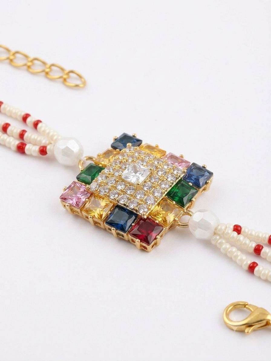 RichMade premium Navratna crystal bracelet rakhi with multicolor stones, cubic zirconia centerpiece, pearl bead strands, and gold clasp for Raksha Bandhan