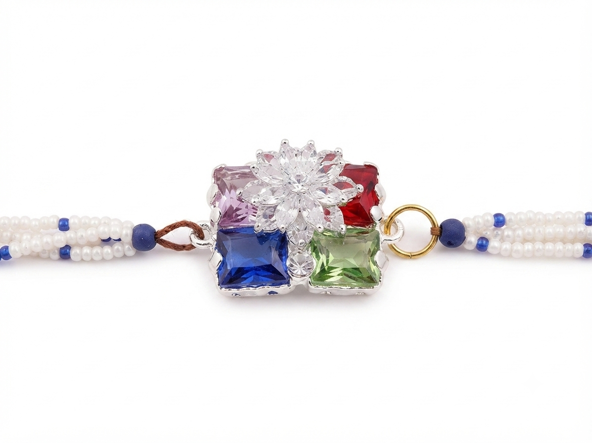 RichMade premium multicolor crystal bracelet rakhi with floral crystal centerpiece, pearl bead strands, and adjustable gold clasp for Raksha Bandhan
