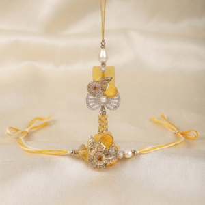 Premium RichMade Bhai Bhabhi Rakhi set including a floral rakhi and matching yellow designer lumba for Raksha Bandhan.