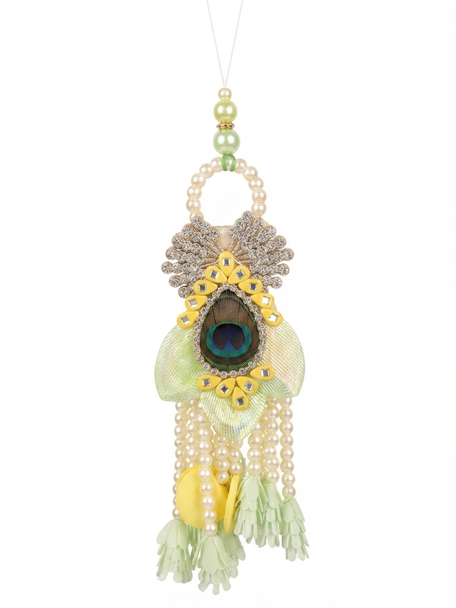 Designer peacock-inspired lumba with pearl tassels, crystal embellishments, and elegant handcrafted detailing for sister-in-law.