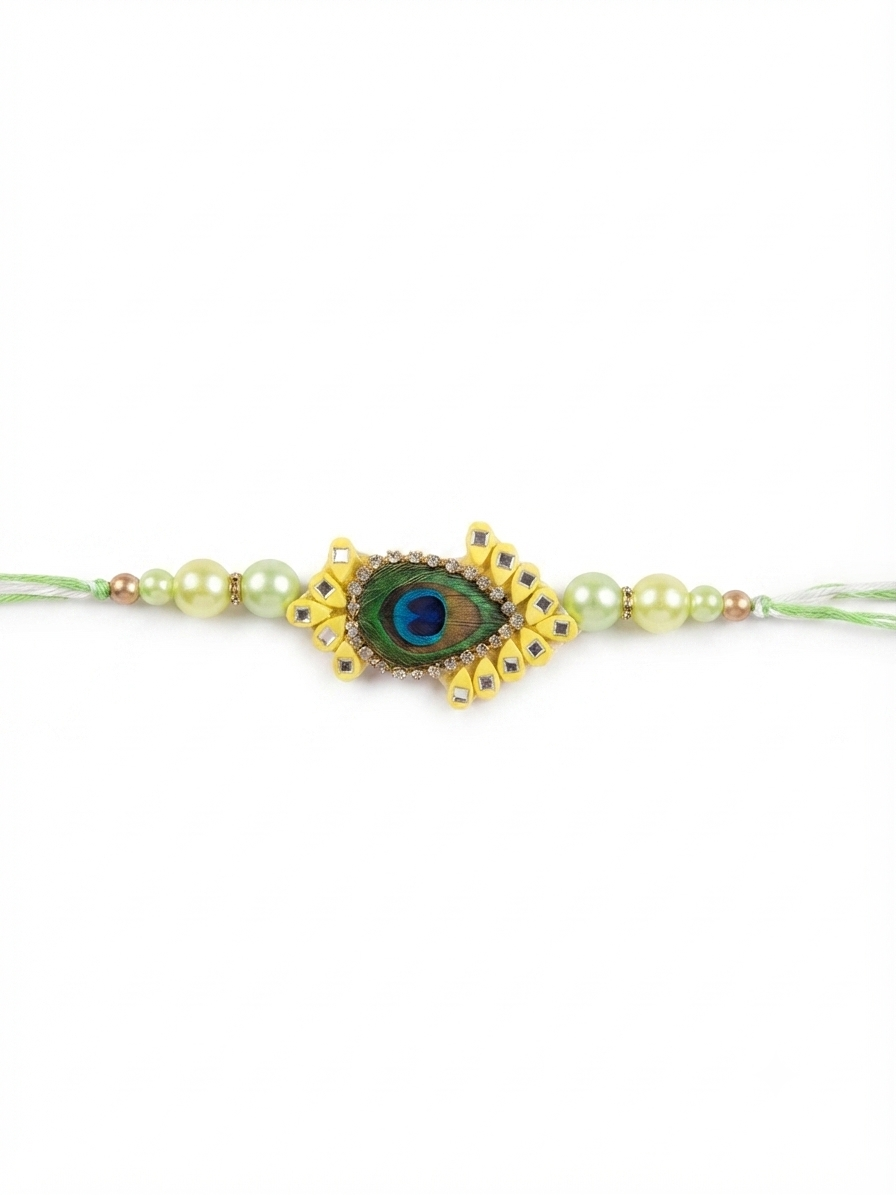 Elegant peacock feather designer rakhi with pearl beads and premium craftsmanship for Raksha Bandhan.