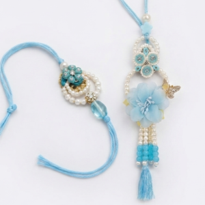 RichMade sky blue floral & Pearls Bhai Bhabhi Rakhi set with matching designer pearl lumba for Raksha Bandhan.
