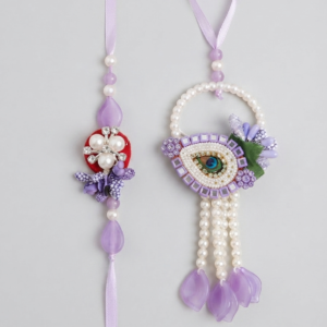 RichMade Peacock Bhai Bhabhi Rakhi Set featuring a floral pearl rakhi for brother and matching peacock designer lumba with pearl tassels for sister-in-law